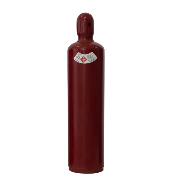 A red fire extinguisher with a pressure gauge, nozzle, and hose, standing upright, isolated on a dark background.