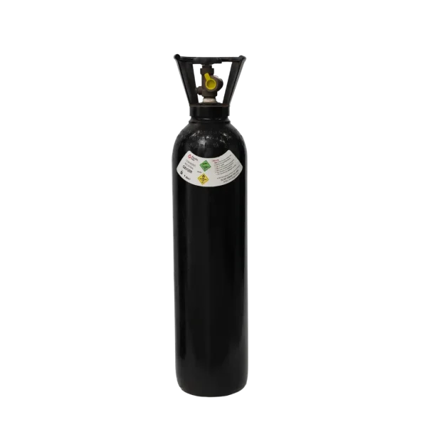 A black gas cylinder with a valve on top stands isolated against a dark background; labels with hazard symbols are visible on the cylinder's side.